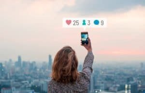 woman with social media icons and boosting online presence