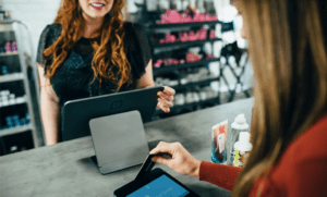 woman making sale with credit card